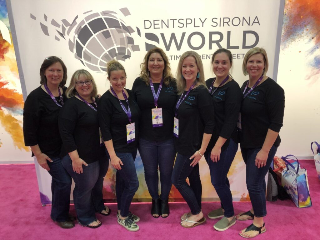 VP Dental team in black shirts and jeans pose together at the Dentsply Sirona World event